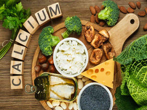 This image contains different types of vegetables with calcium written on it. 